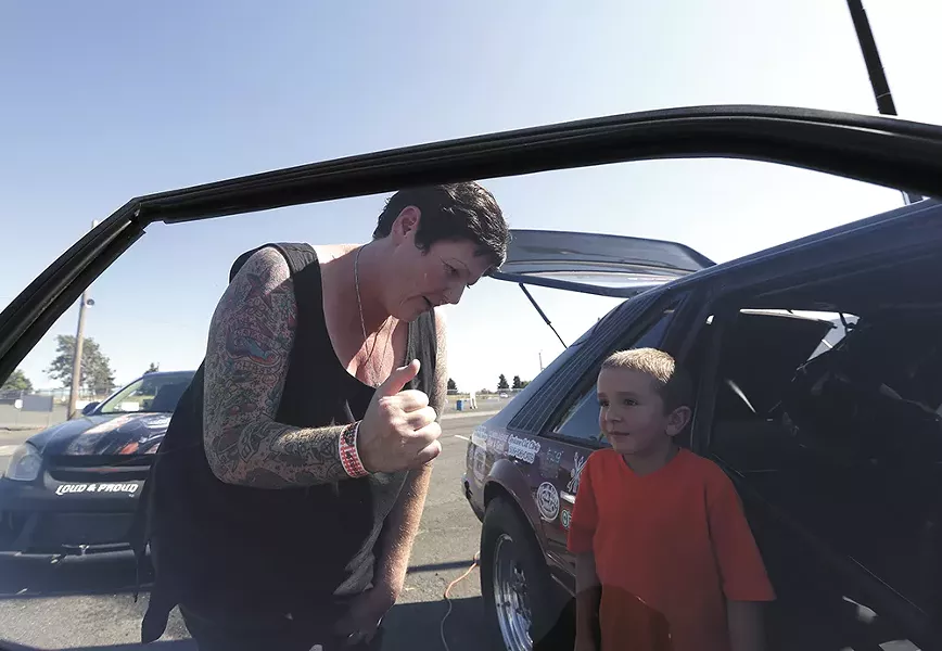 Rachelle Stephens shows off her 1984 Ford Mustang GT to 6-year-old Jacen Lake. - YOUNG KWAK