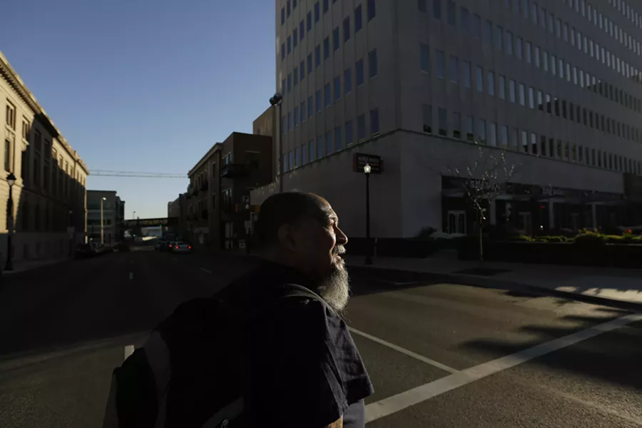 Randy Mora soaks in the sights and sounds of downtown on his first day out of federal custody. - YOUNG KWAK