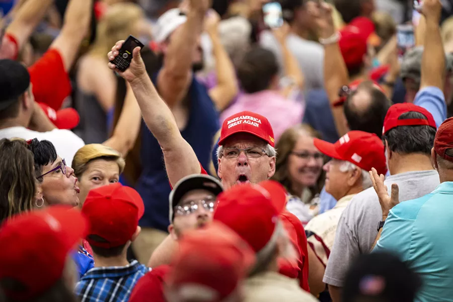 A man yells at reporters at President Donald Trump's rally at a high school outside Columbus, Ohio, Aug. 4, 2018. Disputes over politics have divided Americans’ homes, strained marriages, ruined friendships and invaded the workplace. - AL DRAGO/THE NEW YORK TIMES