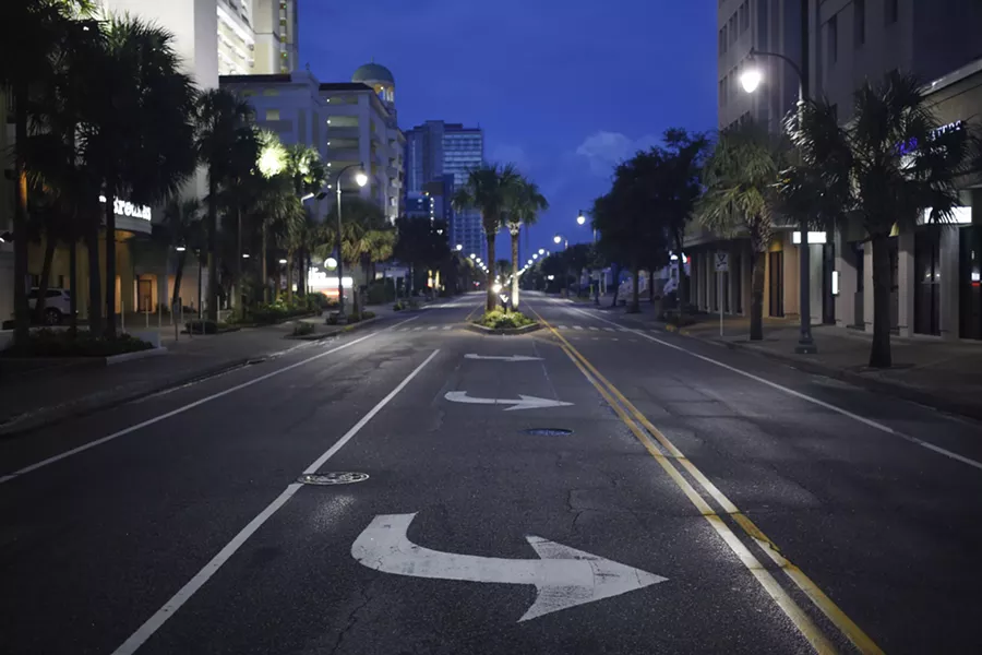 A quiet street at dawn in Myrtle Beach, S.C., Sept. 12, 2018. With millions of coastal residents either on the move or hunkering down anxiously in place, Hurricane Florence surged toward North Carolina on Wednesday, tracing an unusual path that could lead to tremendous destruction — especially if the immense storm dumps enormous amounts of rain as it moves inland. - LUKE SHARRETT/THE NEW YORK TIMES