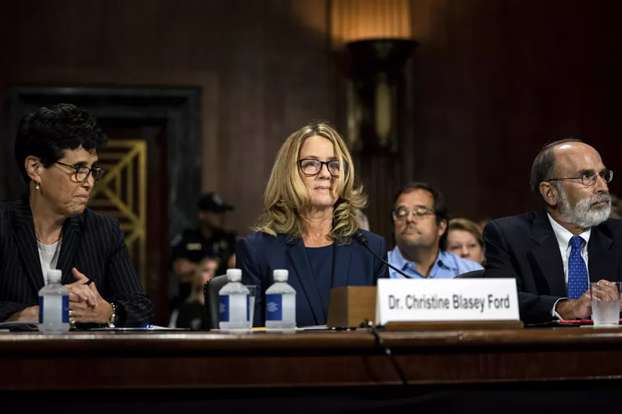 Christine Blasey Ford is flanked by her attorneys, Debra Katz, left, and Michael Bromwich at a Senate Judiciary Committee hearing in Washington on Thursday, Sept. 27, 2018. Blasey testified about her accusation that Judge Brett Kavanaugh, President Trump’s Supreme Court nominee, sexually assaulted her. - ERIN SCHAFF/THE NEW YORK TIMES