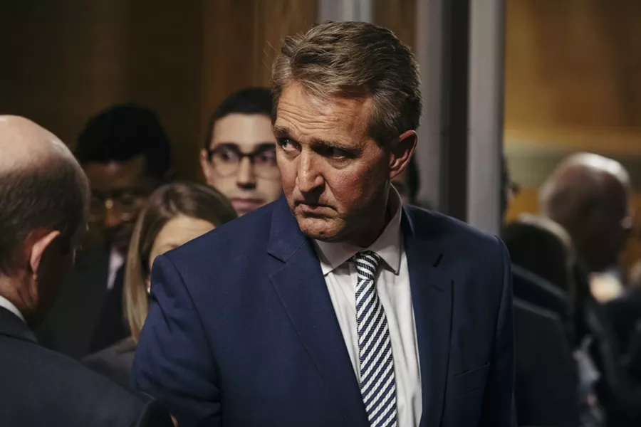 Sen. Jeff Flake (R-Ariz.) leaves a Judiciary Committee hearing where Judge Brett Kavanaugh’s Supreme Court nomination was advanced to a full Senate vote, on Capitol Hill in Washington, Oct. 3, 2018. Flake and Sen. Susan Collins (R-Maine) have both condemned President Donald Trump’s mocking comments toward Christine Blasey Ford, who has accused Judge Brett Kavanaugh of sexual assault. - DAMON WINTER/THE NEW YORK TIMES