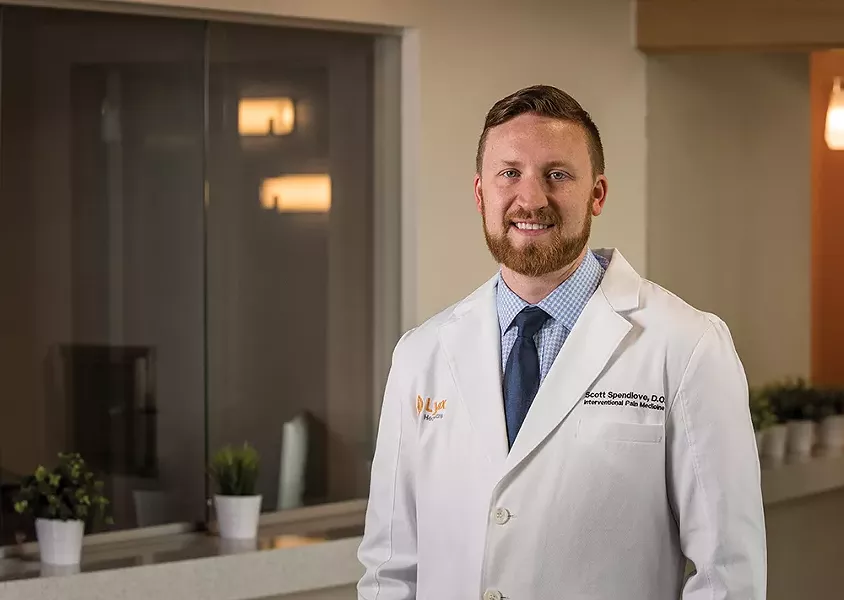 Dr. Scott Spendlove uses his own experiences managing chronic pain to assist others in coping without addictive medications. - ERICK DOXEY PHOTO