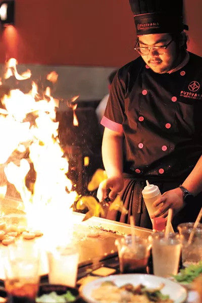 Fujiyama chefs play with fire. - CARRIE SCOZZARO PHOTO