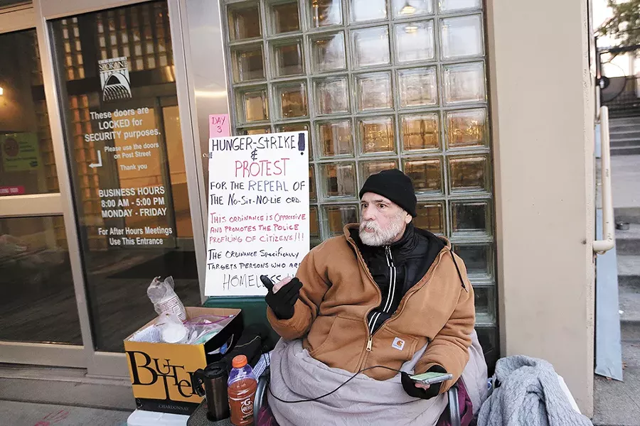 Alfredo LLamedo protests outside Spokane City Hall. - YOUNG KWAK
