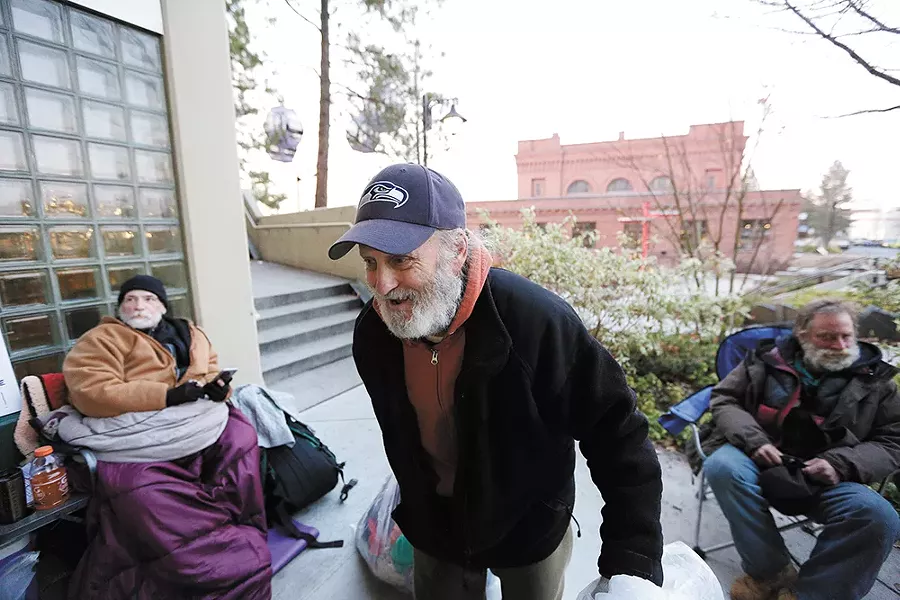 James Welch gathers donations from City Hall to pass out to those in need. - YOUNG KWAK