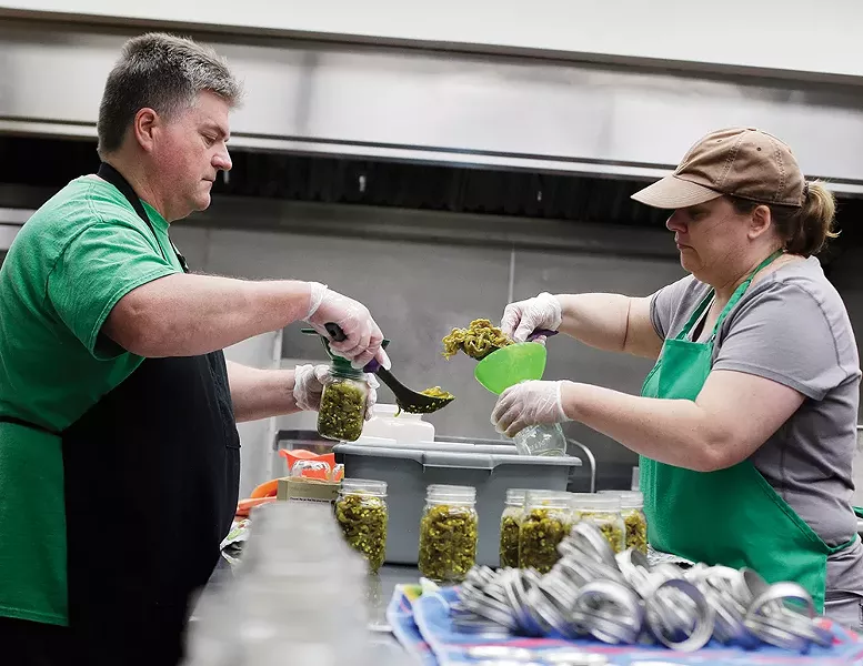 Bob Emmons and Gail Brock use Kitchen Spokane's commercial space to make B&G Sweet Heat Peppers. - YOUNG KWAK