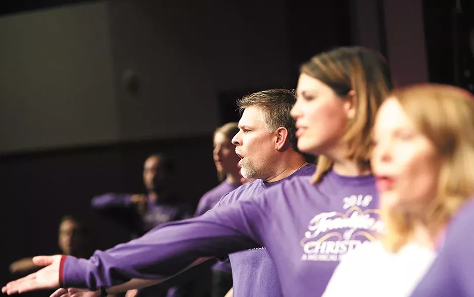 Kevin Walker (center) is one of four family members involved in the Traditions of Christmas show this year. - YOUNG KWAK