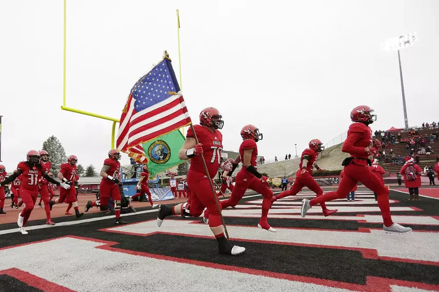 Eastern Washington offensive lineman Matt Meyer (70) and his teammates run onto the field in Cheney earlier this season. - YOUNG KWAK
