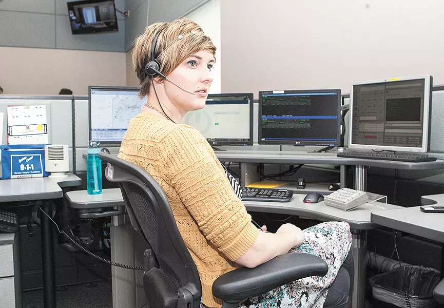 Marci Prettyman remains cool under pressure while fielding 911 calls. - MEGHAN KIRK