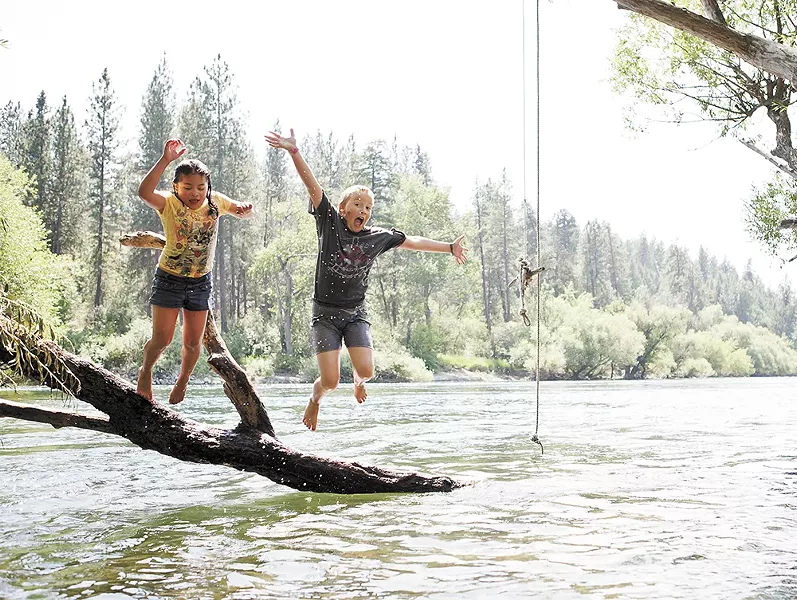 Cousins Livia and Miriam enjoy the river near the T.J. Meenach Bridge. - STEPHEN SCHLANGE PHOTO