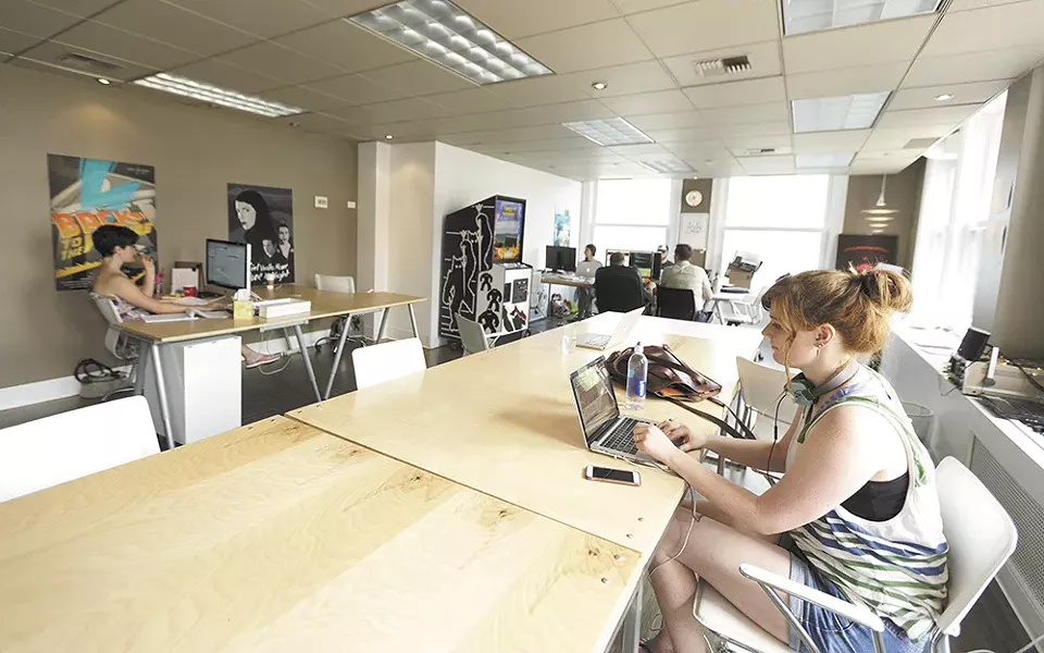 Fish Ladder Marketing graphic designer Casey Stoddard, right, works at Fellow Coworking. - YOUNG KWAK