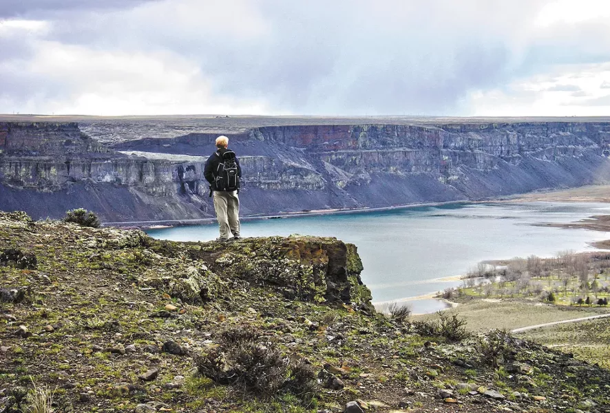 A Spokane Mountaineers member explores Steamboat Rock. - CAROL SMUCKER