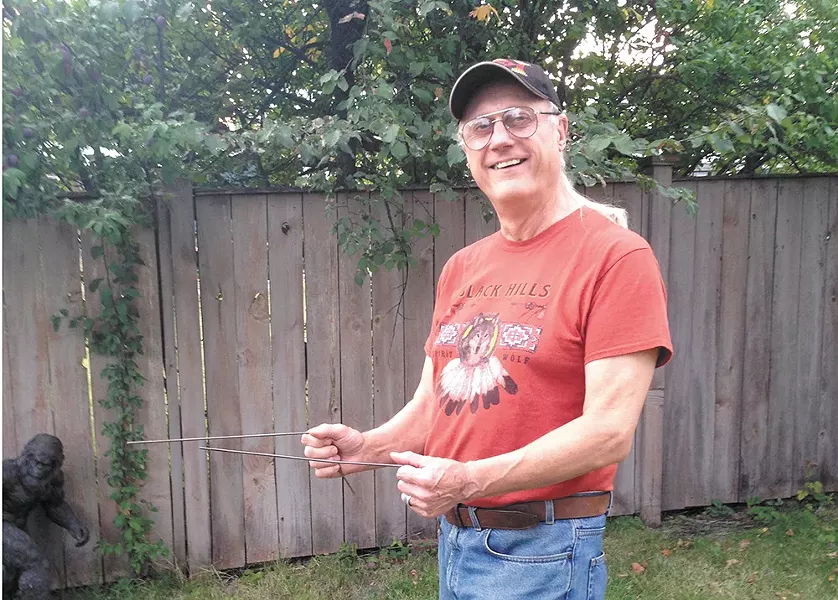 Kewaunee Lapseritis with his dowsing rods.