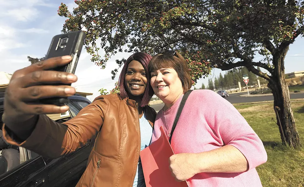 Spokane City Councilwoman Karen Stratton (right) takes a break from campaigning to snap a selfie with local activist Kitara Johnson. - YOUNG KWAK