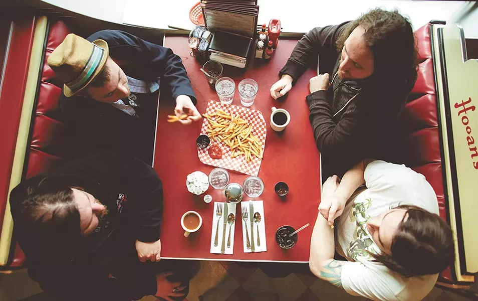 Local rockers Buffalo Jones, clockwise from top right, Jason Johnson, Glenn Case, Brandon Humphreys and Joshua Martin at Hogan's Diner. - KRISTEN BLACK