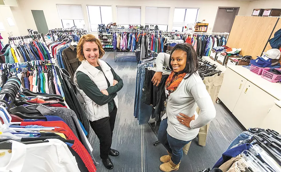 North Central Assistant Principal Wendy Bromley (left) and Community in Schools Support Coordinator Shamerica Daniels help homeless students with clothing. - JEFF FERGUSON