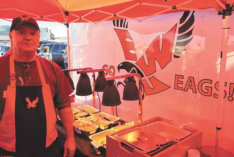 Tim Daniels cooks up a seafood buffet before some Eagles home games. - MAX CARTER