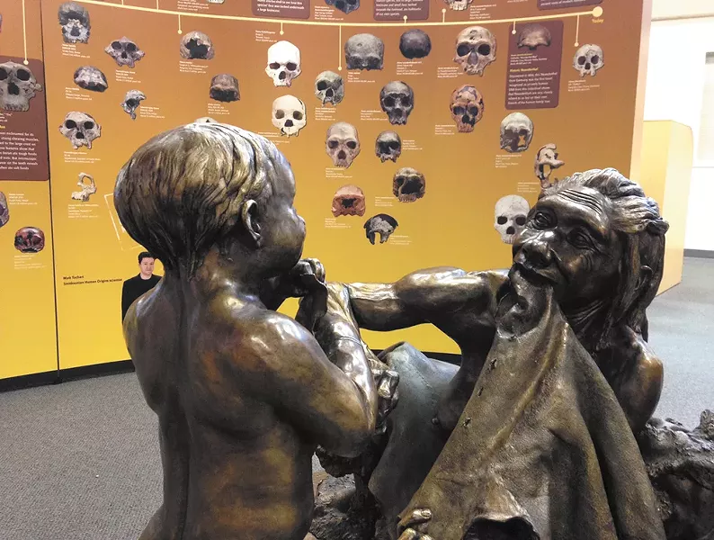 A statue depicting early humans at the North Spokane Library's collaboration with the Smithsonian. - MIKE BOOKEY