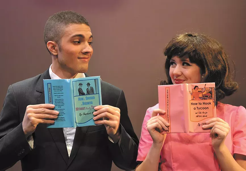 Ilan Hernandez (left) as J. Pierpont Finch and Julian Lee as Rosemary Pilkington.