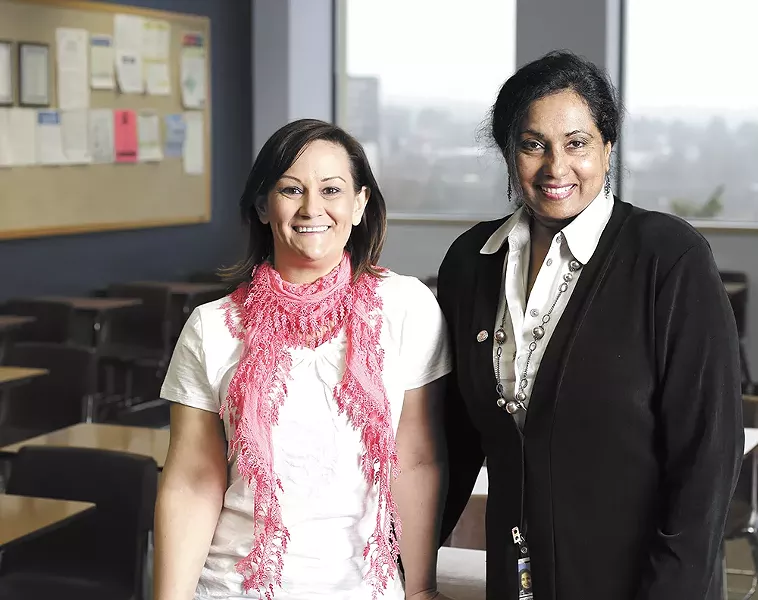 Chief Examiner Gita George-Hatcher (right) and Nicole Goes, an analyst with the civil service department, say the city of Spokane is searching for ways to hire more women. - YOUNG KWAK