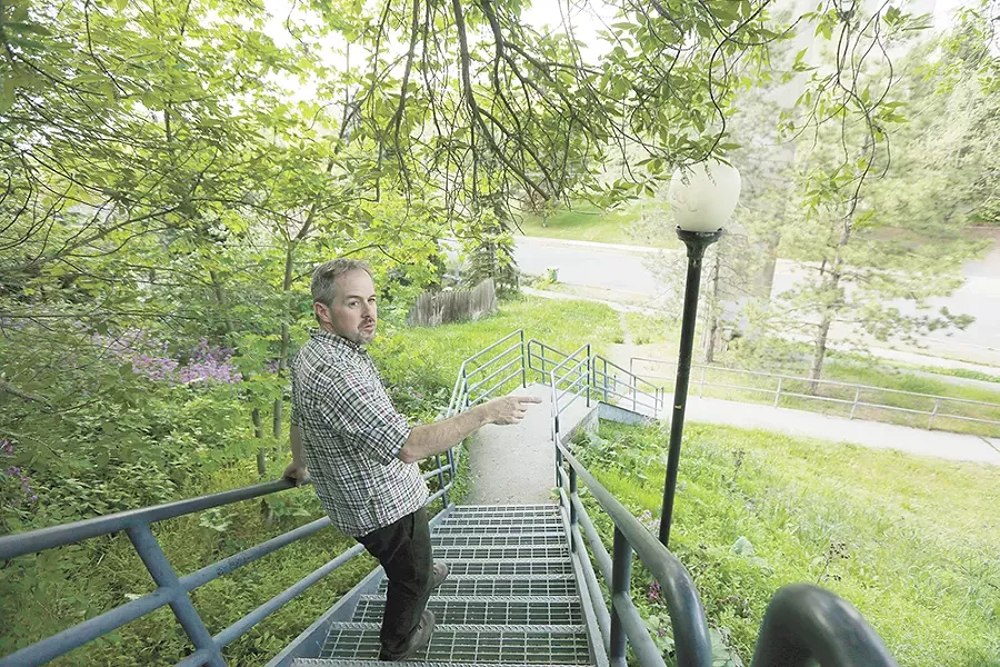 Tod Marshall strolls his Peaceful Valley neighborhood during a rare respite in his schedule as Washington's poet laureate. - YOUNG KWAK
