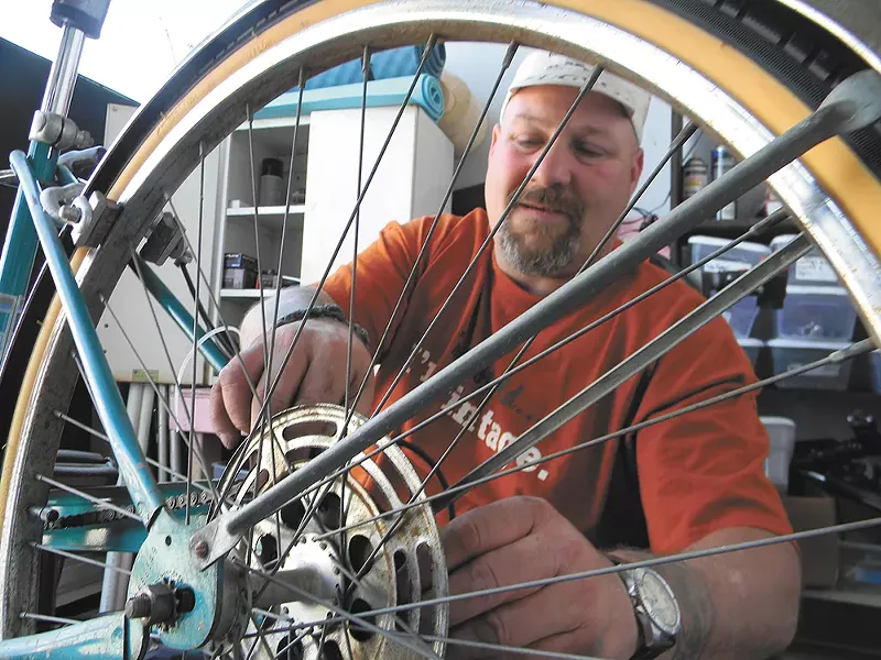 Dan Jackman, a mechanic at Mosaic Community Bike Shop. - JAKE THOMAS