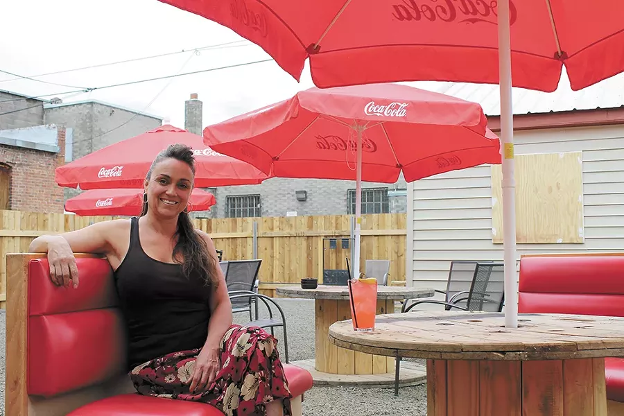 Owner Lora Corners at the Station House's expansive patio area. - FRANNY WRIGHT