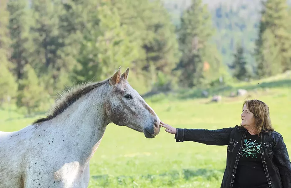 Mary Ciais on the family ranch in May. Of all their horses, Splash was one Rafe particularly liked, both sharing distinctive white hair. - MIKE SALSBURY