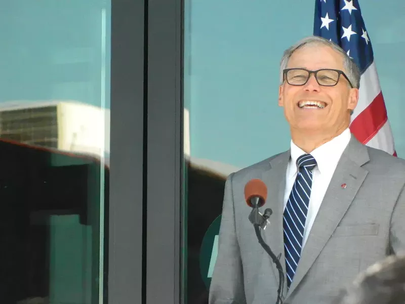 Washington Gov. Jay Inslee had a laugh as oil-train protestors confronted a smiling President Barack Obama at a fundraiser.