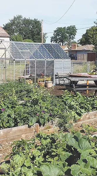 The new community garden has already become a main gathering place. - BLYTHE THIMSEN