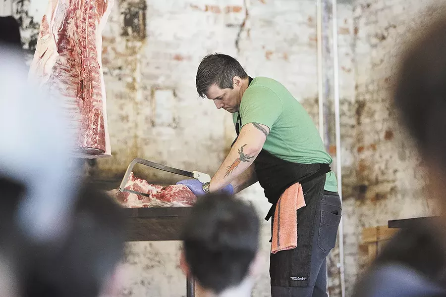 Chef’s Week founder Jeremy Hansen demonstrates how to break down a pig carcass. - YOUNG KWAK