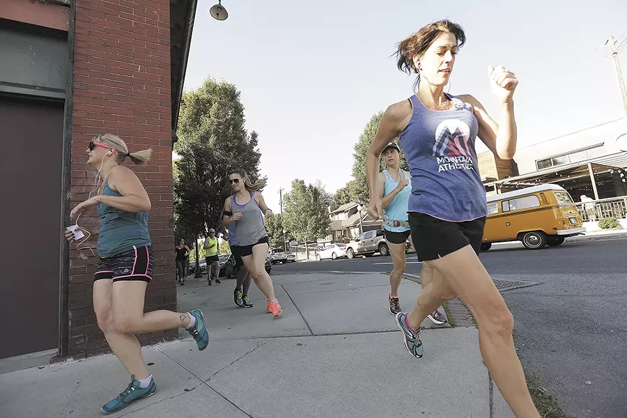 Runners with the Lantern Tap House club take to South Perry. - YOUNG KWAK