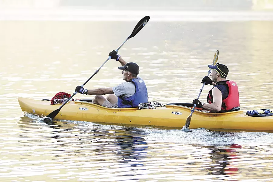 Scott Janetzy, left, and Ray Honovich take to the water at Farragut State Park. - YOUNG KWAK