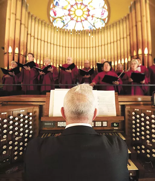 Organist Keith Thomas accompanies the Cathedral of Our Lady of Lourdes choir during mass last weekend. - YOUNG KWAK