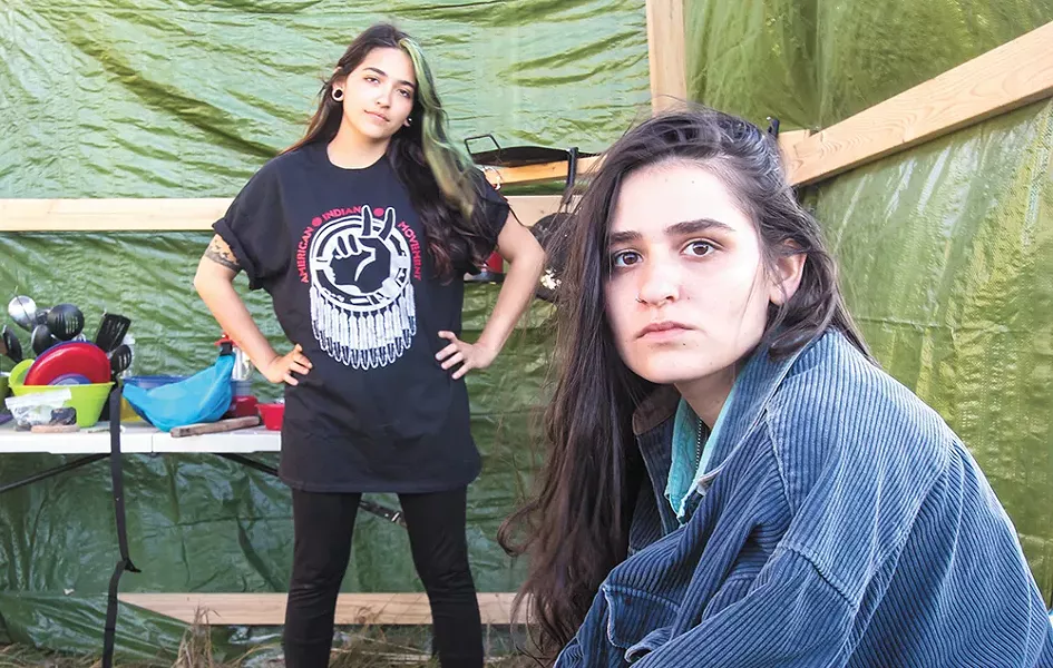 Lena Frame of the Seminole tribe and Tai Trewhella of New York, both 20, maintain a kitchen at the camp. - JEFF FERGUSON