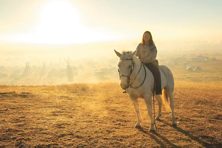 Tracy Hsu from Elgin, North Dakota, and her horse Ashley. - JEFF FERGUSON