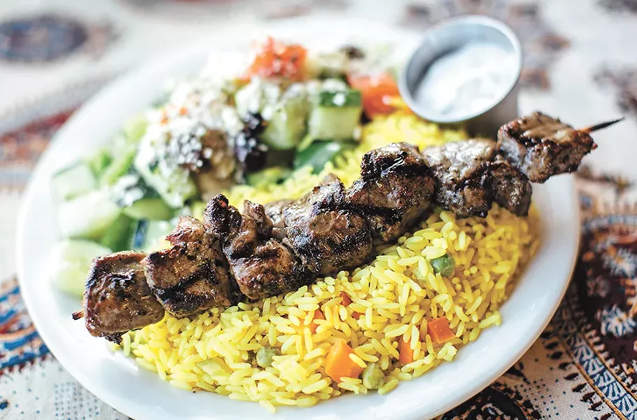 Marinated beef with rice and Greek salad at the Kabob House. - JENNIFER DEBARROS