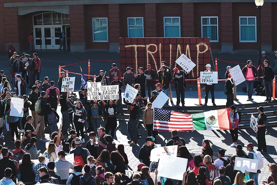 WSU students protest the "Trump Wall" on campus last week. - TAEHLOR CRIM, MURROW NEWS SERVICE