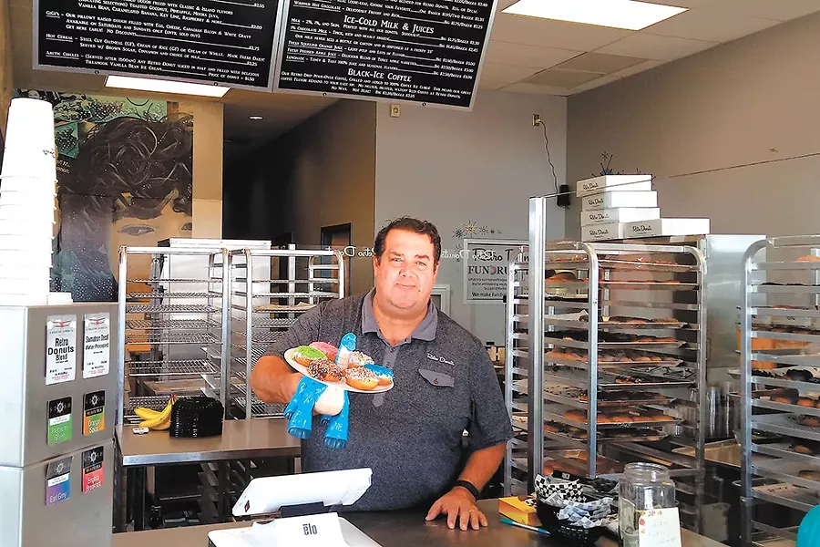 Jon Fine at the recently opened Retro Donuts. - DAN NAILEN