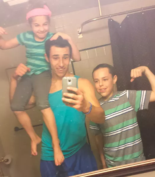 Isaiah and his younger siblings take a selfie. - FACEBOOK