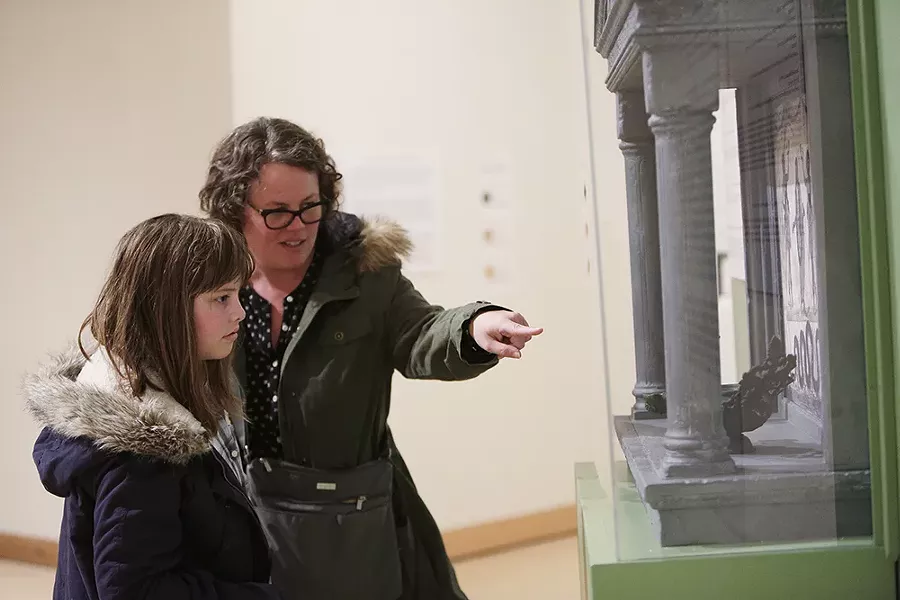 Liana Krissoff and her daughter Thaila, both visiting from West Virginia, look at a lararium, a Roman household shrine. - YOUNG KWAK