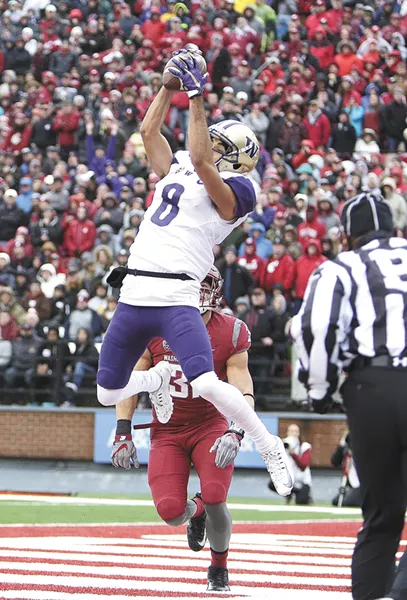 UW's Dante Pettis hauls in one of his two touchdowns. - YOUNG KWAK
