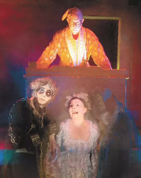 Ron Weeks as Scrooge; Blake King-Krueger as Marley (left), Emily Geddes as the Ghost of Christmas Past and Tim Linton as the Ghost of Christmas Future (right). - CHRIS WOOLEY