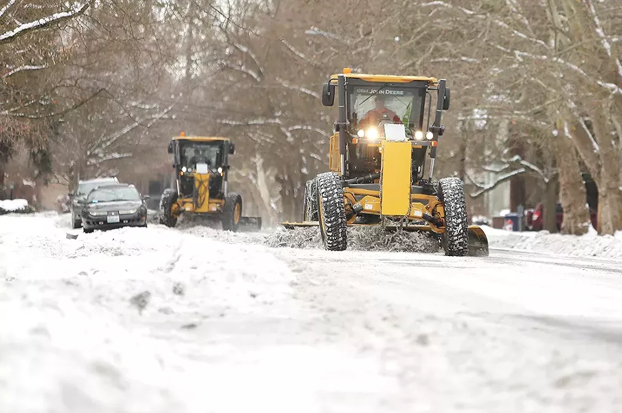Snow plows clean up Spokane's Browne's Addition neighborhood last week. | Young Kwak photo