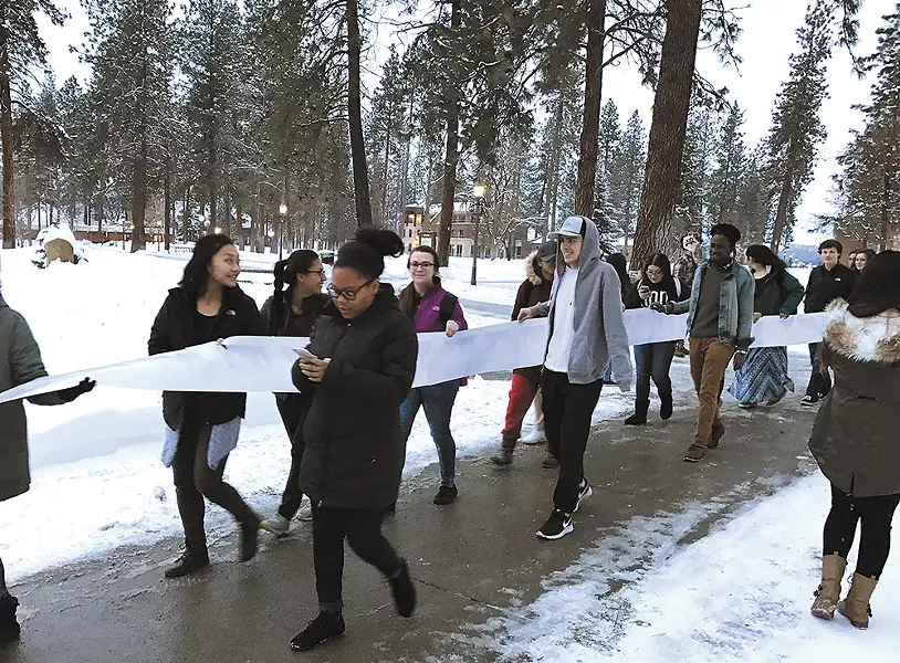 Whitworth students march to the university president's office with a petition to declare the school a "sanctuary campus."
