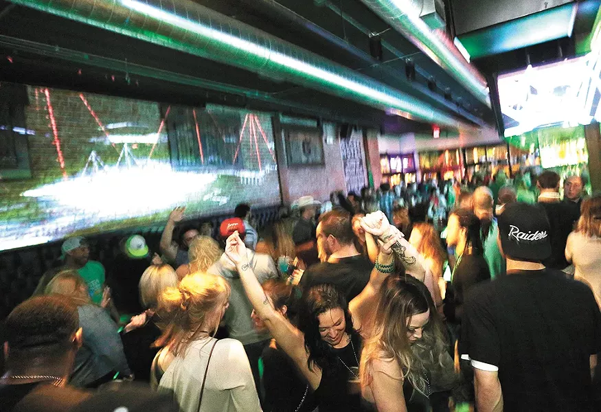 The Globe Bar & Kitchen transforms into a dance club on Friday and Saturday nights. - YOUNG KWAK