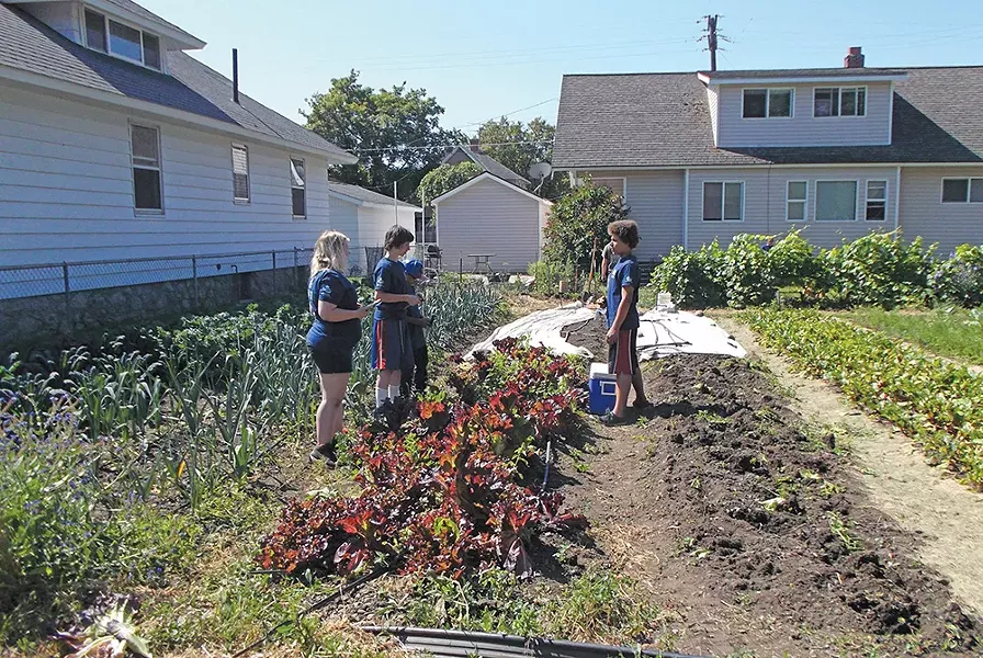 Project Hope kids work in a garden at Boone and A Street, in the summer of 2016.