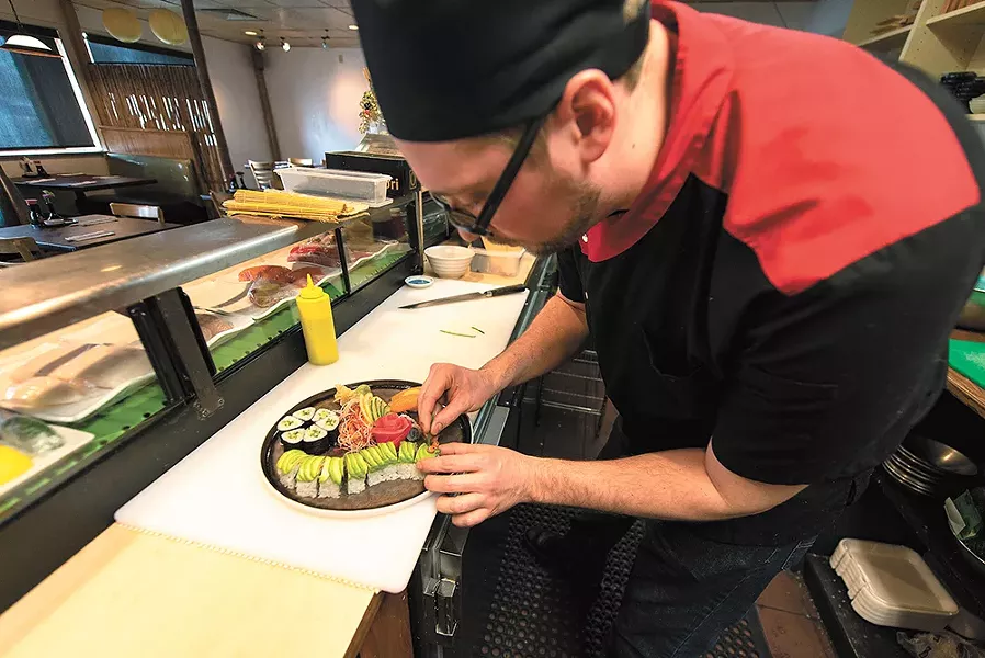 Aji sushi chef Matt Penley stayed on through the transition from Yuzen to Aji BBQ & Sushi. - ERICK DOXEY