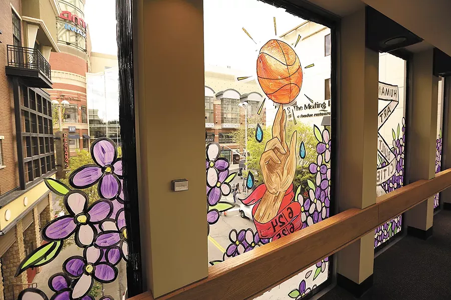 Marina Gulova's skywalk installation features bold-lined art inspired by spring community events, like Hoopfest. - YOUNG KWAK